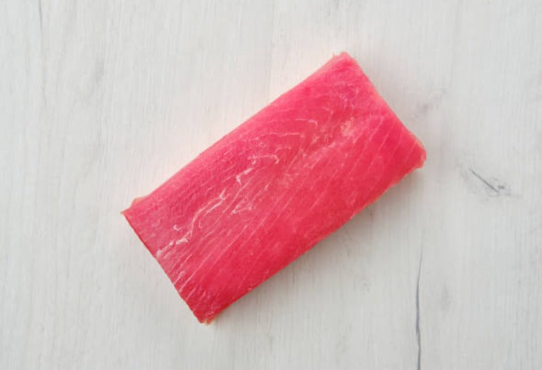 Tuna Saku block, 8 oz sushi-grade yellowfin tuna, displayed on a marble surface — deep red color, perfect for sashimi or searing