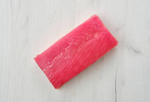 Tuna Saku block, 8 oz sushi-grade yellowfin tuna, displayed on a marble surface — deep red color, perfect for sashimi or searing